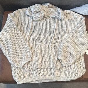 Beach long sleeve cover up top, has a hood and pocket